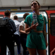 A commuter carries a bottle of water as they exit the carriage of a London Underground tube train in central London, on July 19, 2022 as the country experiences an extreme heat wave.